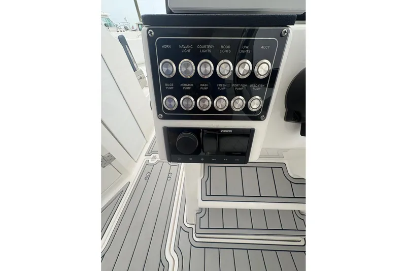 Slide: The Image of Control panel of 2023 Sea Fox 268 Traveler boat with various switches and buttons. - 22