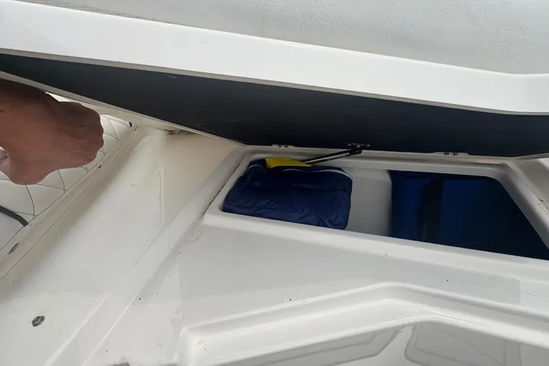 Slide: The Image of Storage compartment in a 2023 Sea Fox 268 Traveler boat, showing interior space and gear. - 11