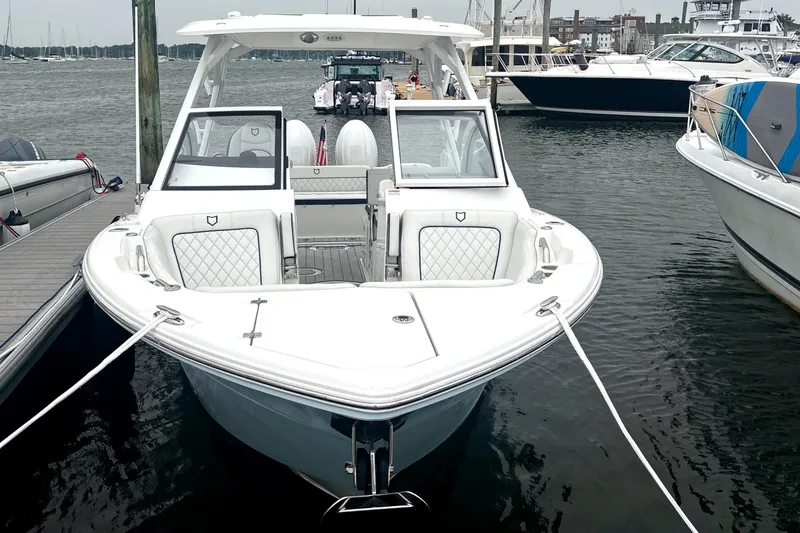 Slide: The Image of 2023 Sea Fox 268 Traveler boat docked in a marina, showcasing sleek design and luxury seating. - 3