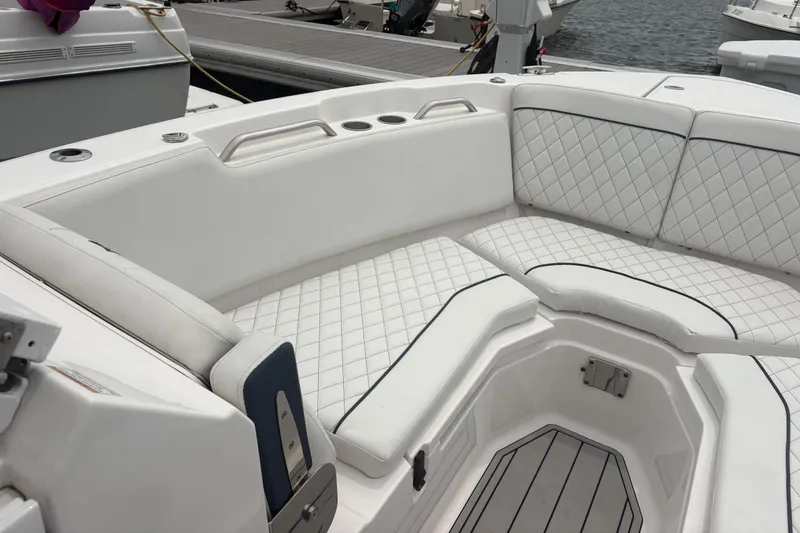 Slide: The Image of 2023 Sea Fox 268 Traveler boat interior with white quilted seating and sleek design. - 7