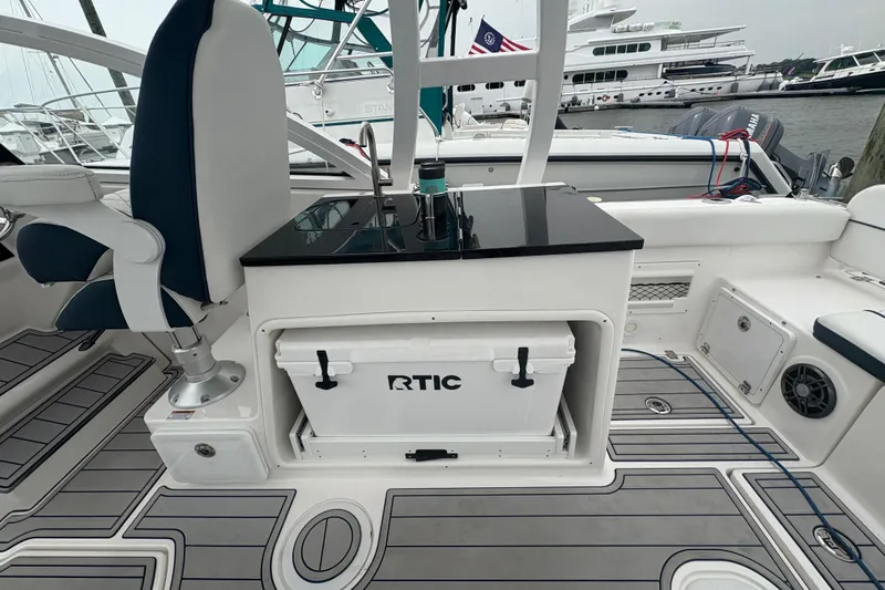 Slide: The Image of 2023 Sea Fox 268 Traveler boat interior with seating and RTIC cooler. - 41