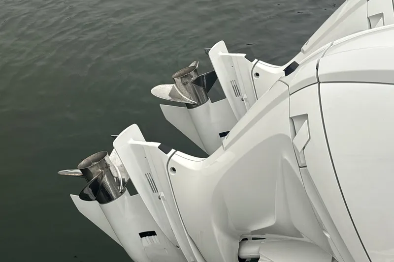 Slide: The Image of 2023 Sea Fox 268 Traveler boat engines on water, showcasing sleek design and propellers. - 60