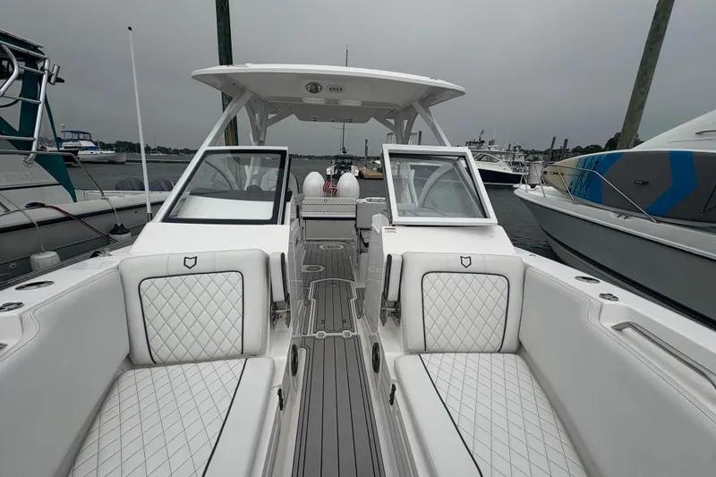 Slide: The Image of 2023 Sea Fox 268 Traveler boat interior with white seating and open deck view. - 5