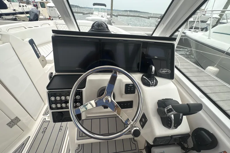 Slide: The Image of Helm of 2023 Sea Fox 268 Traveler boat with modern controls and navigation screens. - 18