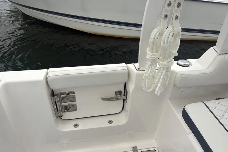 Slide: The Image of 2023 Sea Fox 268 Traveler boat interior with white seating and coiled rope. - 46