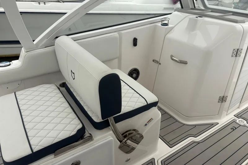 Slide: The Image of 2023 Sea Fox 268 Traveler boat interior with white quilted seating and sleek design. - 30