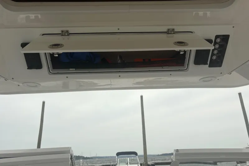 Slide: The Image of 2023 Sea Fox 268 Traveler boat storage compartment with open hatch, showcasing interior space. - 40
