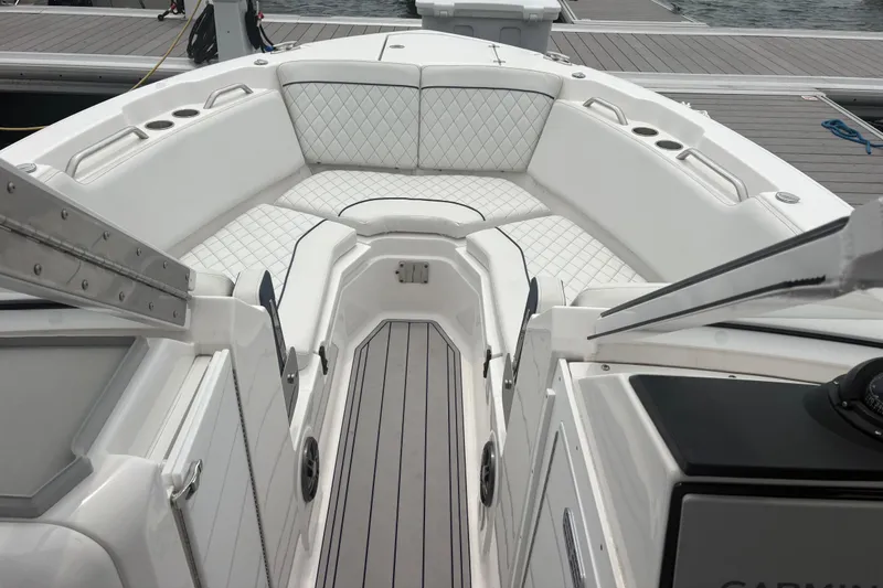 Slide: The Image of 2023 Sea Fox 268 Traveler boat interior with white cushioned seating and sleek design. - 6