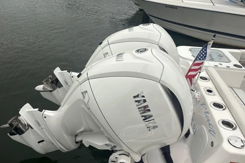Slide: The Image of 2023 Sea Fox 268 Traveler with twin Yamaha outboard engines and American flag. - 59