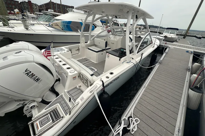 Slide: The Image of 2023 Sea Fox 268 Traveler boat docked, featuring Yamaha engines and sleek design. - 12
