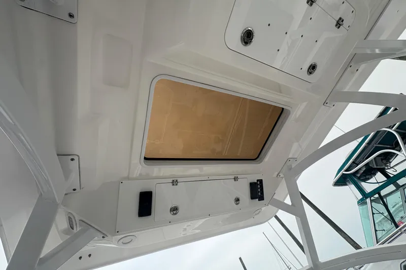 Slide: The Image of 2023 Sea Fox 268 Traveler boat interior ceiling with hatch and storage compartments. - 38