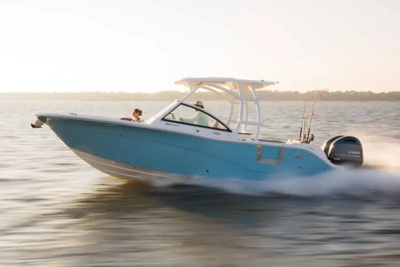Slide: The Image of Manufacturer Provided Image: 2023 Sea Fox 268 Traveler boat cruising on water at sunset. - 62