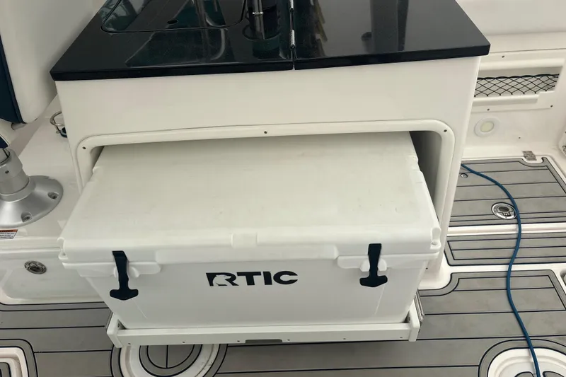 Slide: The Image of RTIC cooler on 2023 Sea Fox 268 Traveler boat with sleek deck design. - 43