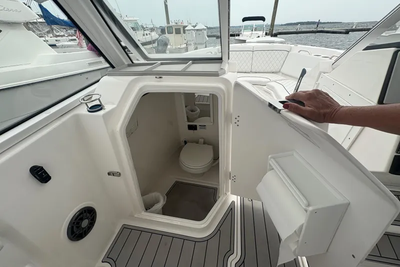 Slide: The Image of 2023 Sea Fox 268 Traveler boat interior with open cabin door and visible toilet. - 34
