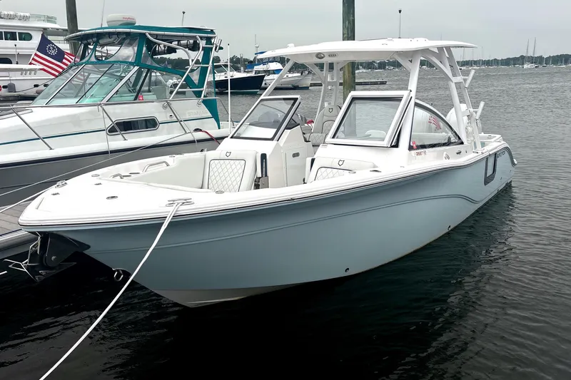 Slide: The Image of 2023 Sea Fox 268 Traveler boat docked in a marina, featuring sleek design and modern amenities. - 2