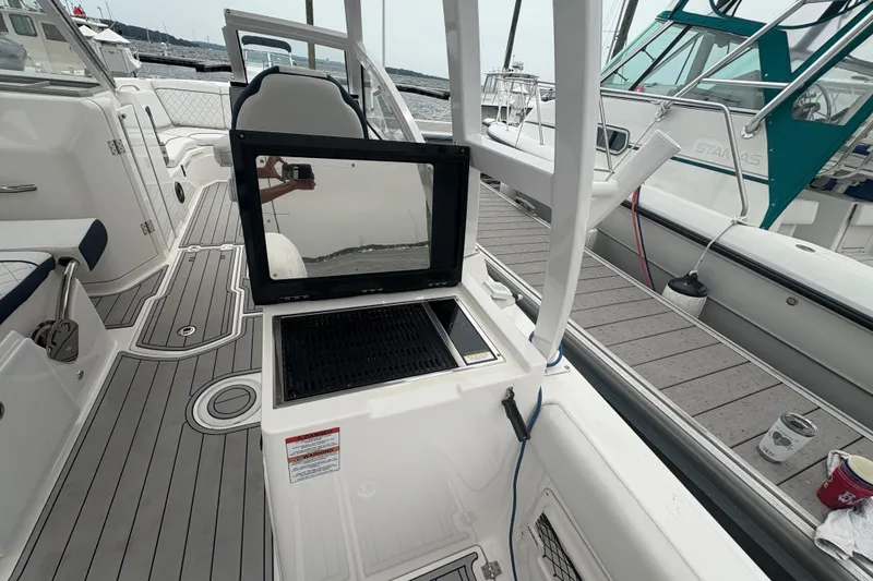 Slide: The Image of 2023 Sea Fox 268 Traveler boat interior with open storage compartment and sleek design. - 45