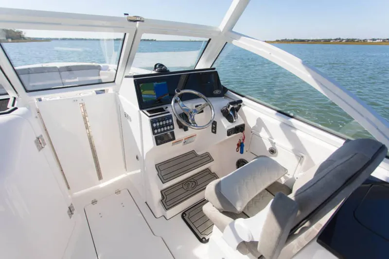 Slide: The Image of Manufacturer Provided Image: 2023 Sea Fox 268 Traveler boat cockpit with modern controls and comfortable seating. - 68