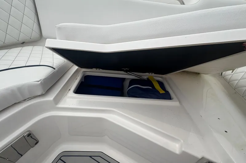 Slide: The Image of Storage compartment on 2023 Sea Fox 268 Traveler boat with cushioned seating. - 10