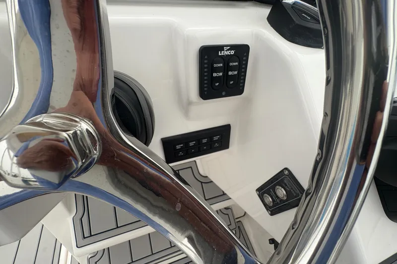 Slide: The Image of Steering wheel and controls of 2023 Sea Fox 268 Traveler boat cockpit. - 23