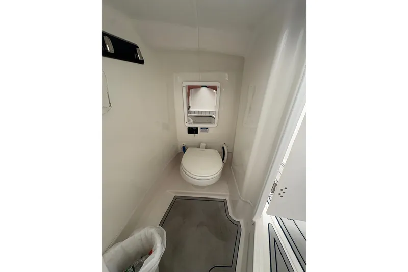 Slide: The Image of 2023 Sea Fox 268 Traveler boat interior bathroom with toilet and mirror. - 35