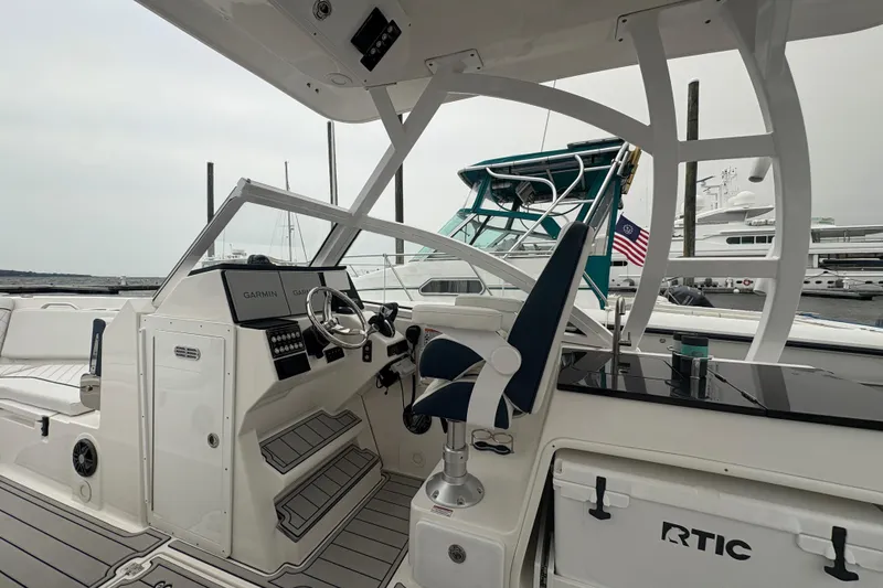Slide: The Image of 2023 Sea Fox 268 Traveler boat interior with helm, seating, and navigation equipment. - 16