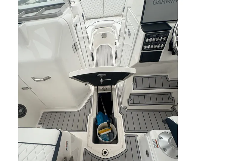 Slide: The Image of 2023 Sea Fox 268 Traveler boat interior with open storage compartment and modern dashboard. - 36