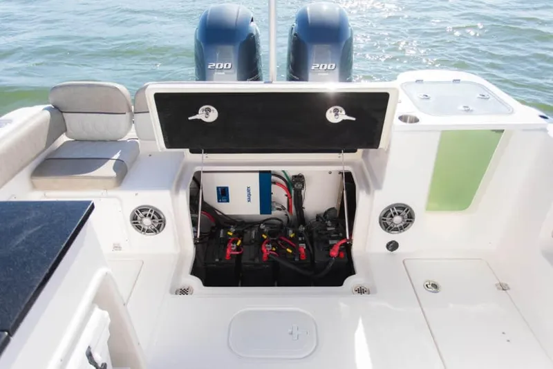Slide: The Image of Manufacturer Provided Image: 2023 Sea Fox 268 Traveler boat with open engine compartment and twin 200 horsepower motors. - 70