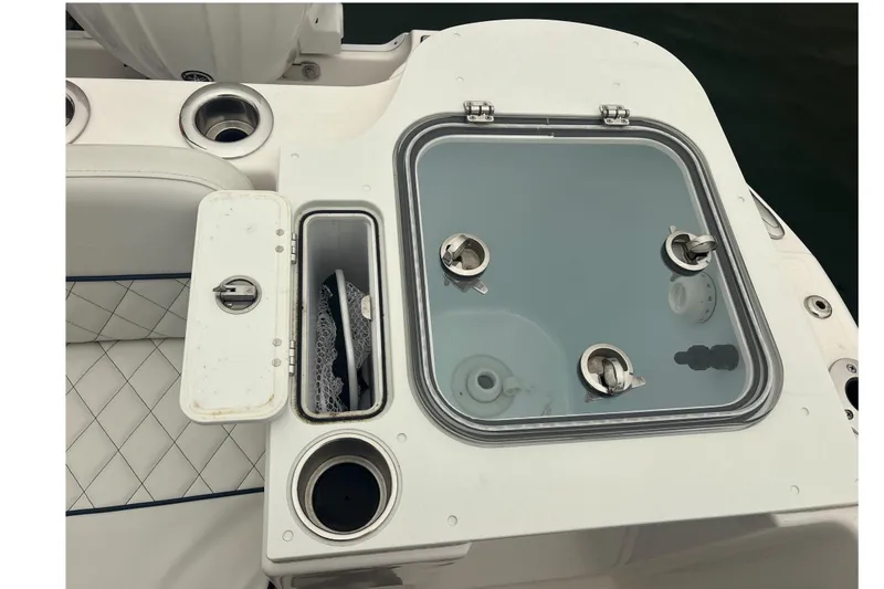 Slide: The Image of 2023 Sea Fox 268 Traveler boat console with storage compartments and cup holders. - 51