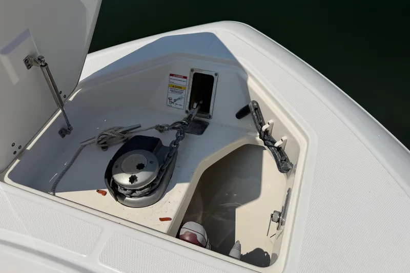 Slide: The Image of 2017 Boston Whaler 330 Outrage anchor locker with rope and chain storage. - 46