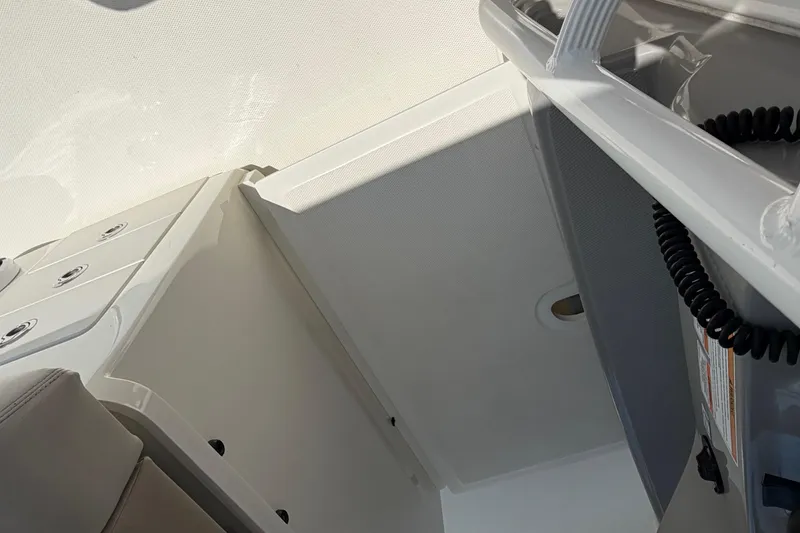 Slide: The Image of Interior view of a 2017 Boston Whaler 330 Outrage boat, showcasing sleek design elements. - 29
