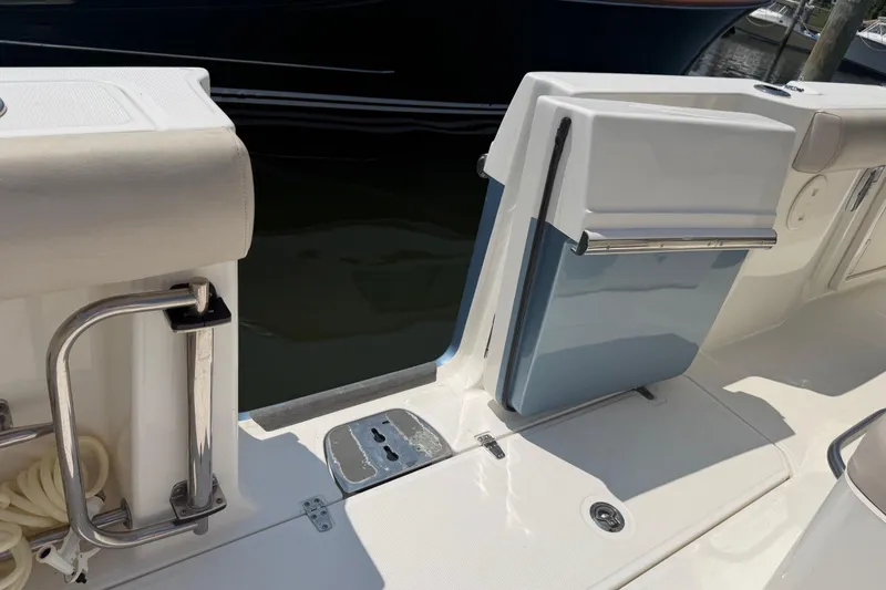 Slide: The Image of 2017 Boston Whaler 330 Outrage boat deck with open transom door and stainless steel railing. - 33