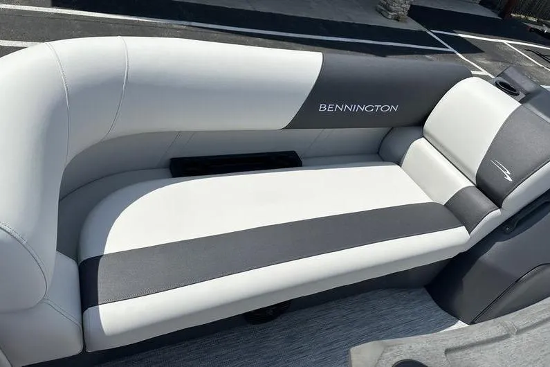 Slide: The Image of 2026 Bennington S Quad Bench 20 SSR boat seat, featuring sleek gray and white upholstery. - 11