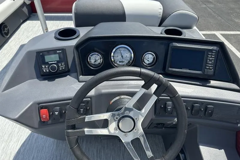 Slide: The Image of Dashboard of 2026 Bennington S Quad Bench 20 SSR with steering wheel and gauges. - 13