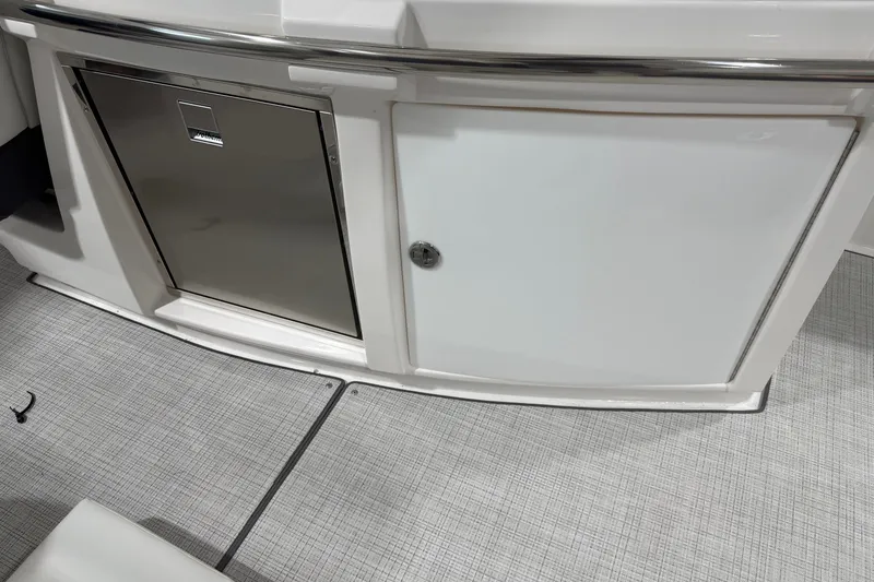 Slide: The Image of 2027 Regal 3300 boat interior with stainless steel cabinet and sleek design. - 11