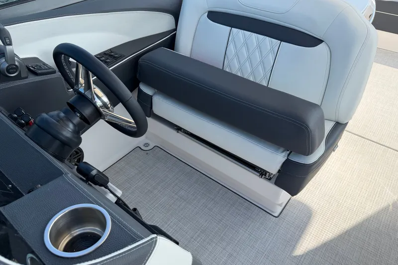 Slide: The Image of Interior of 2027 Regal 3300 boat featuring steering wheel and luxurious seating. - 21