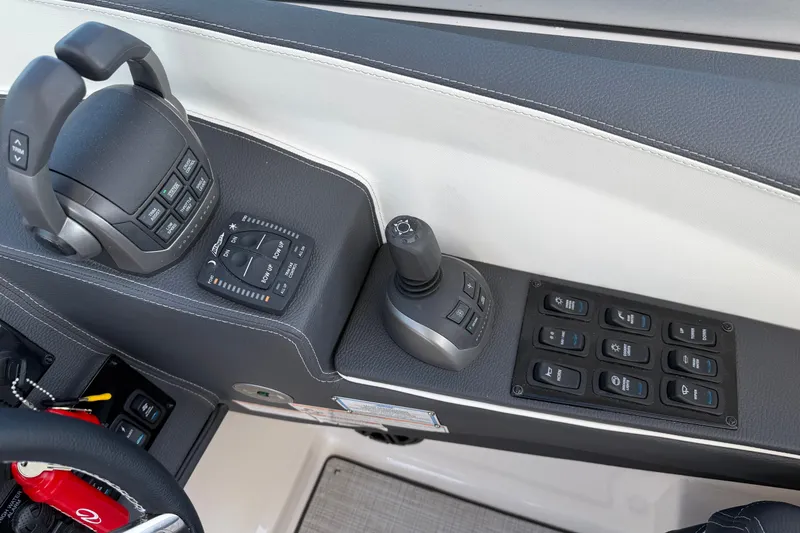 Slide: The Image of Control panel of 2027 Regal 3300 boat with joystick and switches. - 30