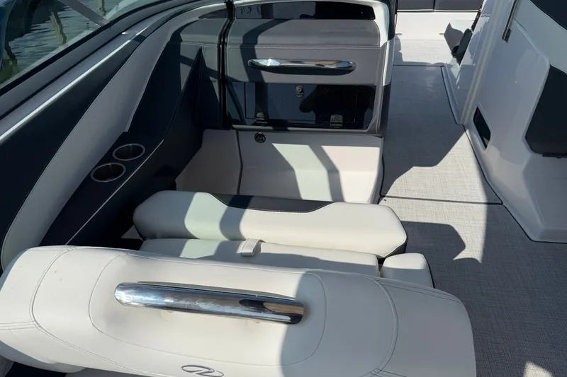 Slide: The Image of Interior of a 2027 Regal 3300 boat featuring sleek seating and modern design elements. - 19