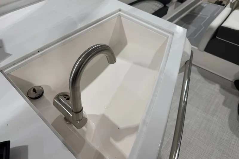 Slide: The Image of Stainless steel sink on 2027 Regal 3300 boat, featuring modern design and functionality. - 13