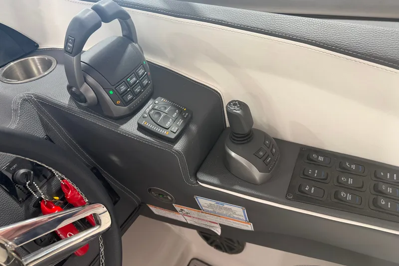 Slide: The Image of Control panel of a 2027 Regal 3300 boat with joystick and buttons. - 10
