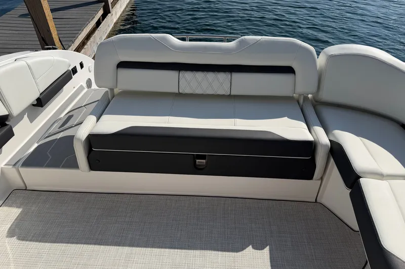 Slide: The Image of Luxurious seating on a 2027 Regal 3300 boat, docked by the water. - 7