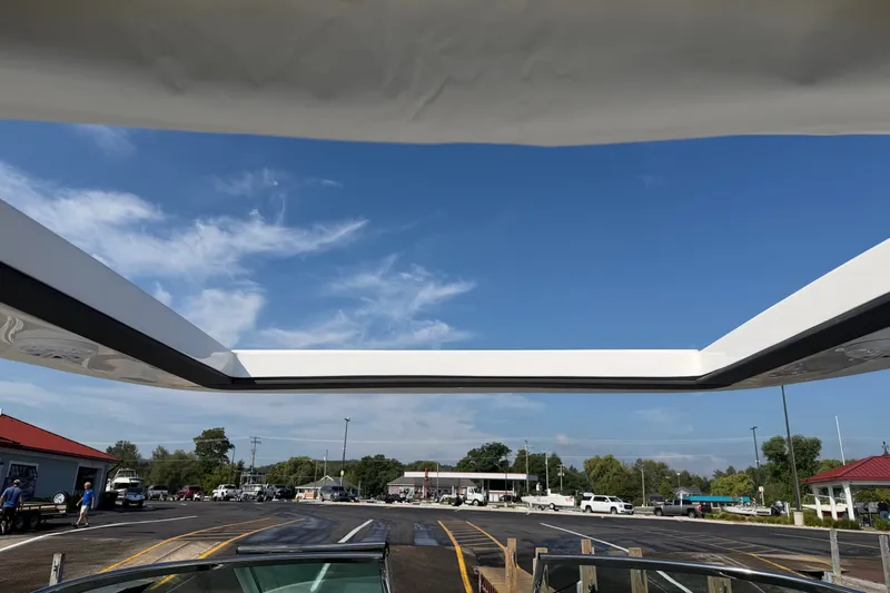 Slide: The Image of View from a 2027 Regal 3300 boat, showcasing a clear blue sky and marina. - 27