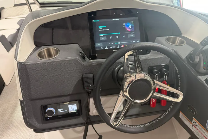 Slide: The Image of Dashboard of a 2027 Regal 3300 boat with modern controls and touchscreen display. - 9