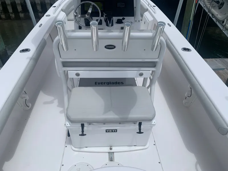 Slide: The Image of The image shows the cockpit of a 2023 Everglades 243 Center Console boat with a Yeti cooler. - 13