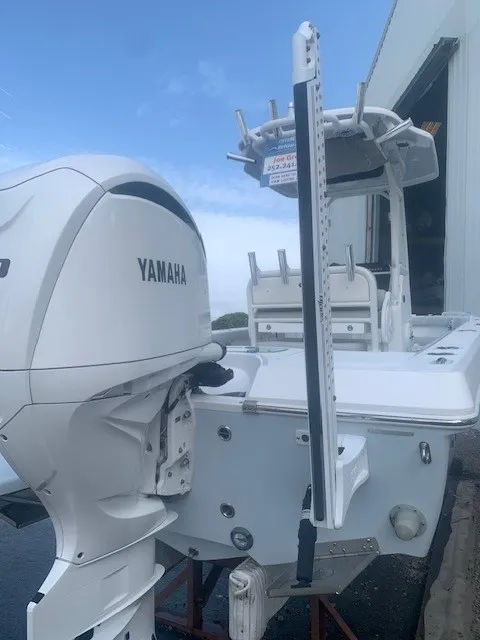 Slide: The Image of A 2023 Everglades 243 Center Console boat with a Yamaha outboard motor. - 48