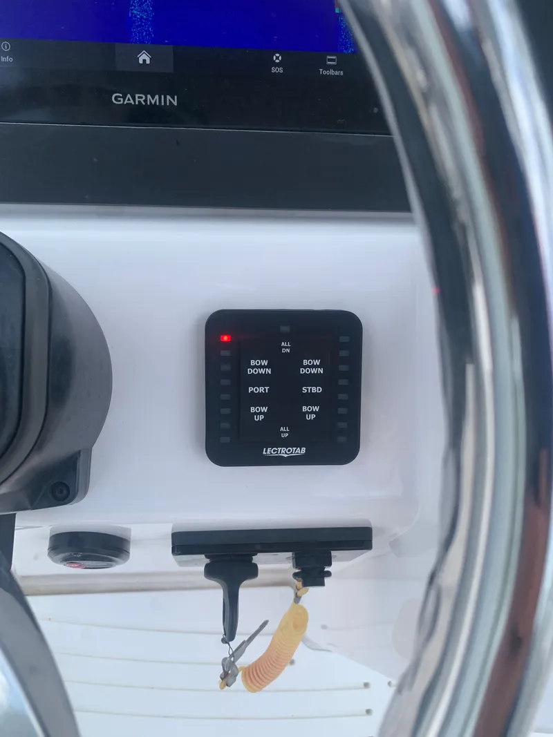 Slide: The Image of Close-up of a control panel featuring a Garmin screen and a Lenco control switch. - 29
