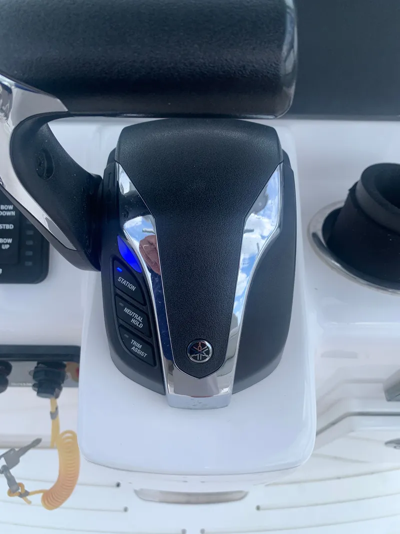 Slide: The Image of Close-up of the control console on a 2023 Everglades 243 Center Console boat. - 30