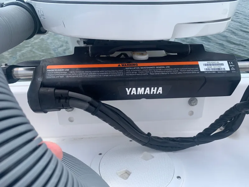Slide: The Image of Close-up of a Yamaha engine on an Everglades 243 Center Console boat. - 38