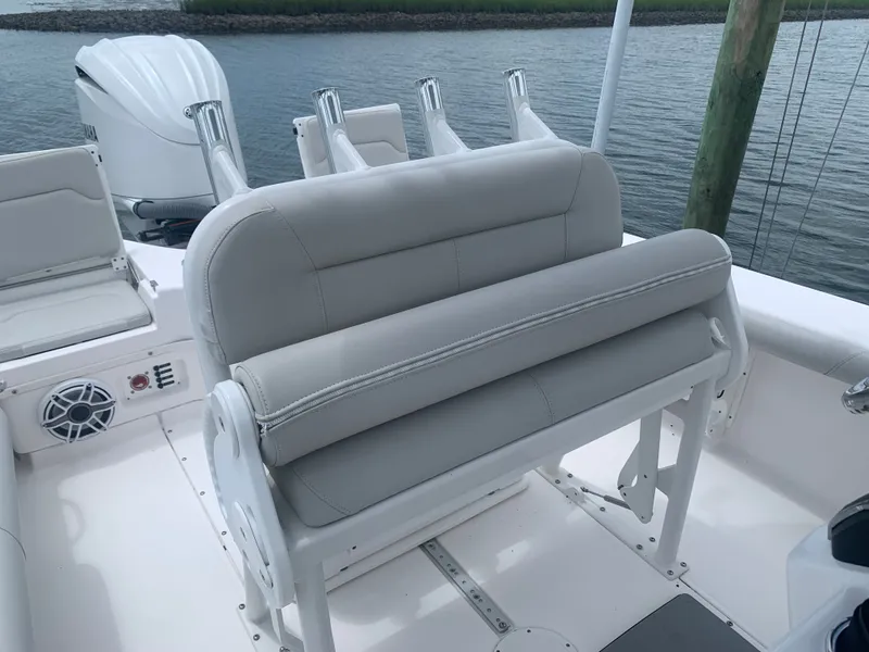 Slide: The Image of The image shows the cockpit of an Everglades 243 Center Console boat with gray upholstery. - 20