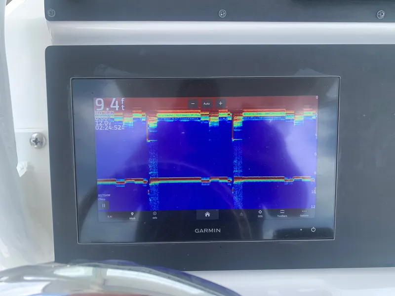 Slide: The Image of A Garmin fishfinder displays depth measurements and underwater structures on a screen. - 28