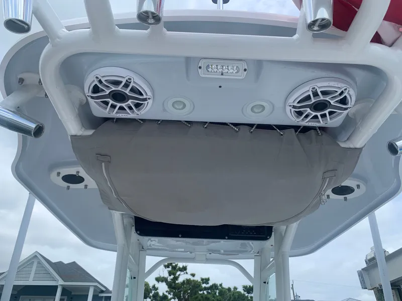 Slide: The Image of The image shows the T-top of an Everglades 243 Center Console boat with speakers and lighting. - 39